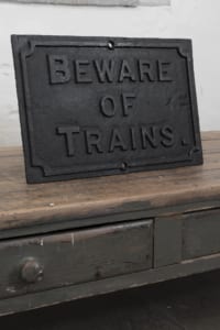 Cast Iron Beware of Trains sign