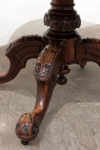 Antique Victorian walnut table with snap top and carved supports