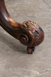 Antique Victorian oval walnut table with snap top and intricately carved legs