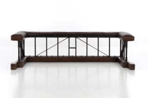 Antique wrought iron and oak club fender with original leather upholstery