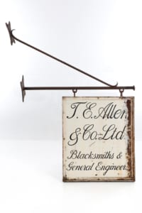 Double sided British vintage cast iron shop sign
