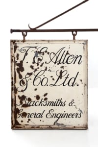 Original vintage double sided cast iron shop advertising sign