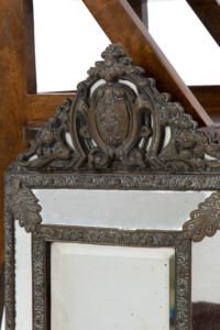 19th century brass repoussé cushion mirror