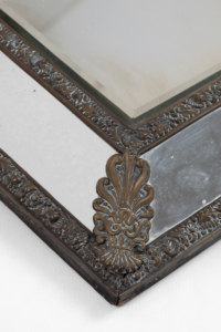 19th century brass repoussé cushion wall mirror