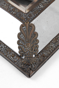 French antique brass repoussé cushion wall mirror