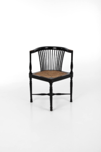Arts and crafts ebonised corner chair