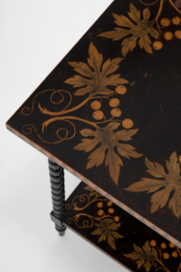 antique penwork table with decorative berry foliage