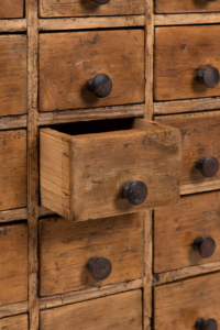 early 20th century pine apothecary drawers