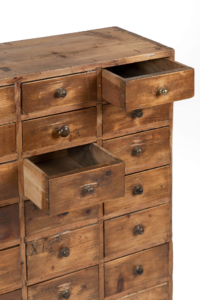 Antique bank of Victorian apothecary workshop drawers