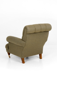 Upholstered classic vintage armchair with deep seat