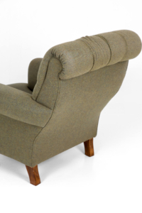 Vintage upholstered deep seat armchair brass castors