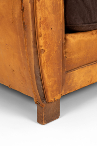 Distressed leather club chairs