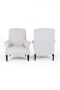 pair of antique armchairs in blue ticking
