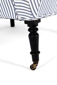 antique armchair on brass castors